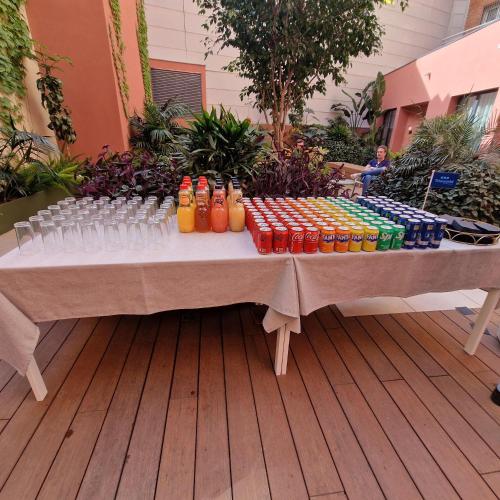 a table with a bunch of bottles and drinks on it at ARCELON HOTEL - From 2023 in Barcelona