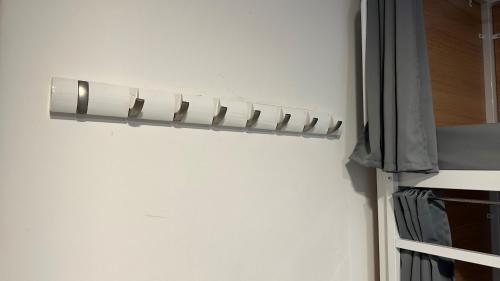 a metal rack on the side of a wall at Smart Camden Inn in London