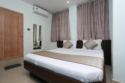 Katil atau katil-katil dalam bilik di Hotel O Aashray Guest House