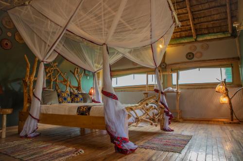 Ένα ή περισσότερα κρεβάτια σε δωμάτιο στο Embogo Safari Lodges