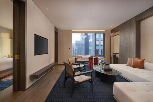 a living room with a couch and a table at InterContinental Xi'an Hi-Tech Zone in Xi'an