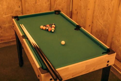 a pool table with the balls on it at Paysage 伊豆高原 in Ito