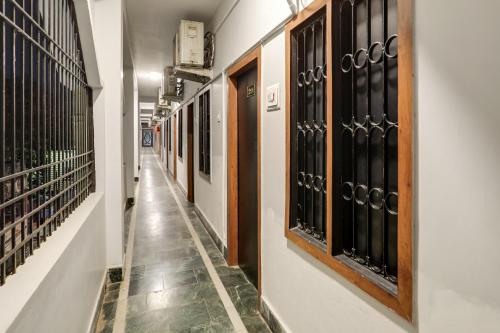 a hallway with a row of wine racks at Flagship Shree Ram Residency in Cuttack