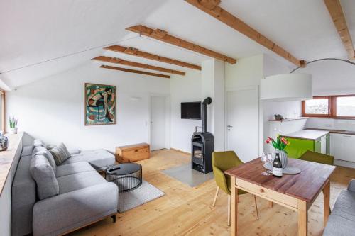 a living room with a couch and a table at Ferienwohnung OberGuess in Leutschach