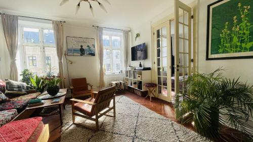 a living room with a couch and a table at ApartmentInCopenhagen Apartment 1604 in Copenhagen