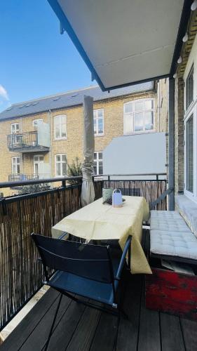 a patio with a table on a balcony at ApartmentInCopenhagen Apartment 1604 in Copenhagen