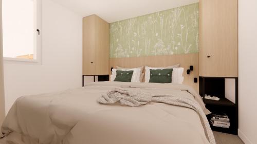 a bedroom with a large white bed with a blanket at Vakantiewoning Westkapelle Piet Mondriaanpad 3 in Westkapelle