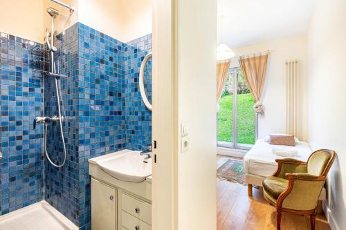 a bathroom with a shower and a sink at GuestReady - Prime haven in Montparnasse in Paris