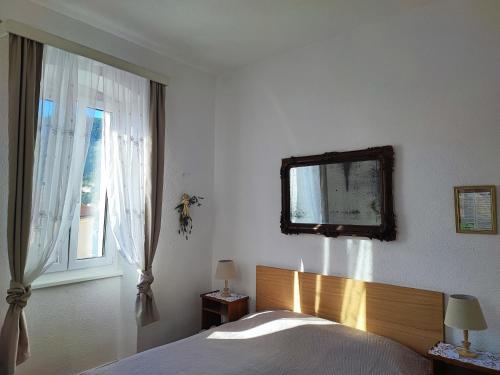 Ένα ή περισσότερα κρεβάτια σε δωμάτιο στο APARTMAN RIVA 2
