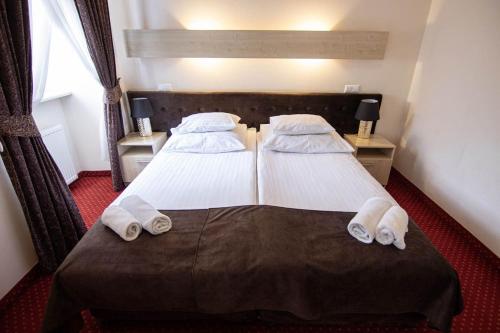 Katil atau katil-katil dalam bilik di Hotel Zamkowy