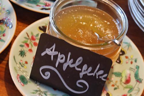 a jar of sauce on a plate with a sign on it at Hotel Vorderburg in Schlitz