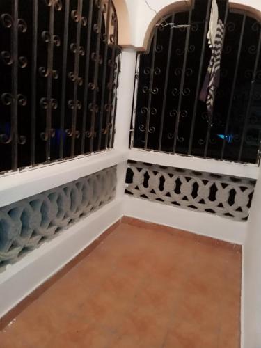 a room with a bunch of black wine bottles at Schneider in Mtwapa