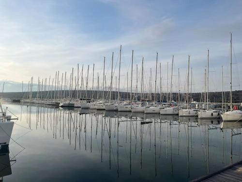 a bunch of boats docked in a harbor at Panorama Penthouse Punat in Punat