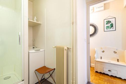 a bathroom with a shower and a toilet and a sink at GuestReady - Peaceful Haven in the 14th arr. in Paris