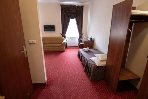 Katil atau katil-katil dalam bilik di Hotel Zamkowy