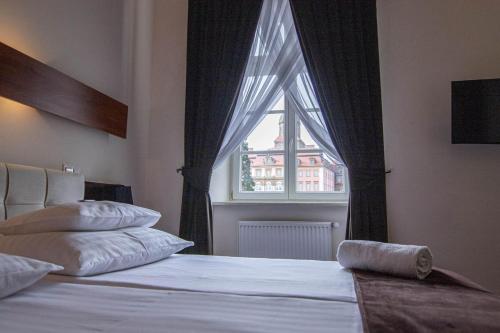 Katil atau katil-katil dalam bilik di Hotel Zamkowy