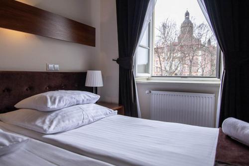 Katil atau katil-katil dalam bilik di Hotel Zamkowy