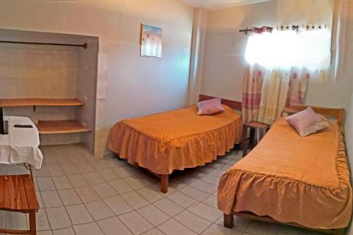 Кровать или кровати в номере La Casa Discreta Cochabamba