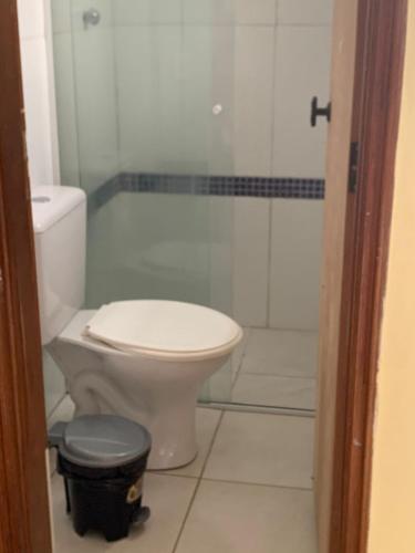 a bathroom with a toilet and a shower at Hotel Village in Sao Paulo