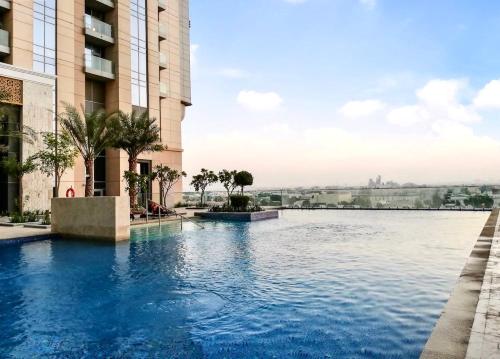 a swimming pool in the middle of a building at Lux BnB I Amna Tower I Panaromic Views in Dubai