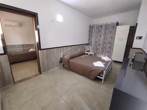 a hospital room with a bed and a projection screen at Re Sole Resort&Spa in Grottaglie