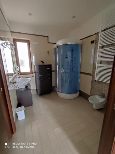 a large bathroom with a large shower and two sinks at Re Sole Resort&Spa in Grottaglie