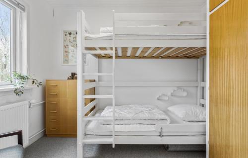a white bunk bed in a white room at Amazing Home In Skagen With Kitchen in Skagen
