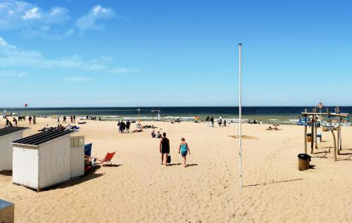 a group of people standing on a beach at Awesome Apartment In Oostende With Wifi in Ostend