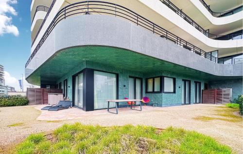 a building with a ping pong table in front of it at Awesome Apartment In Oostende With Wifi in Ostend