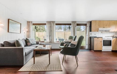 a living room with a couch and a table at Awesome Home In Vordingborg With Wifi in Vordingborg