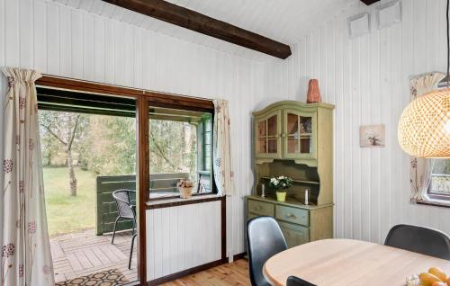 a dining room with a table and a window at Awesome Home In Vordingborg With Wifi in Vordingborg