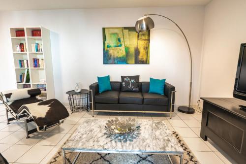 a living room with a couch and a table at Garlande Hôtel Avignon Centre in Avignon