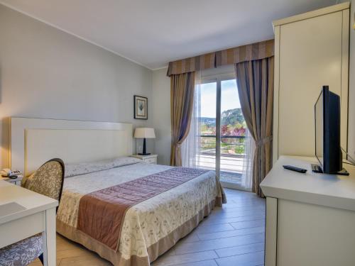 Postel nebo postele na pokoji v ubytování Parc Hotel Germano Suites & Apartments