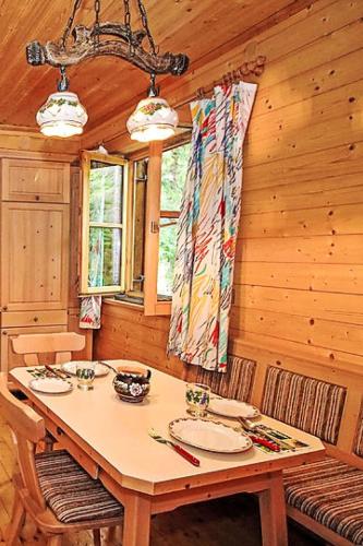 a dining room with a table in a cabin at Chalet Haus Ahlfeld by Interhome in Sankt Aegyd am Neuwalde