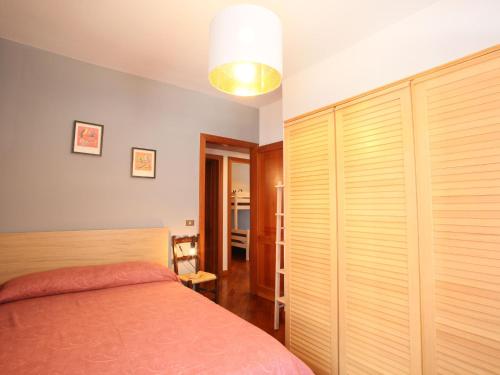 a bedroom with a bed and a large closet at Apartment I Gerani by Interhome in Scanno