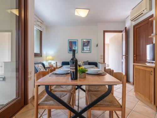 a kitchen and dining room with a table and chairs at Holiday Home Carlo-1 by Interhome in Villasimius