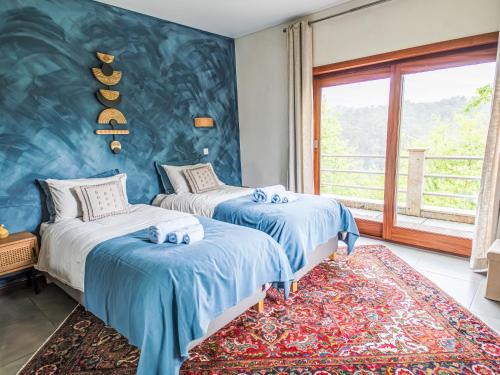 Ένα ή περισσότερα κρεβάτια σε δωμάτιο στο Villa Rio Lima Retreat by Interhome