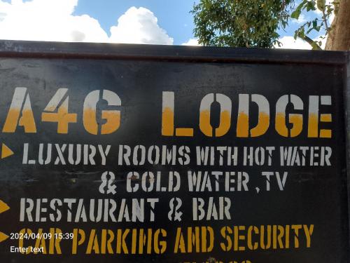 a sign for a library rooms with hot water and chilled watertry restaurant and bar at A 4G LODGE in Mugumu