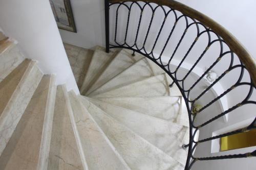 a spiral staircase in a house at Luxor Garden in Batumi