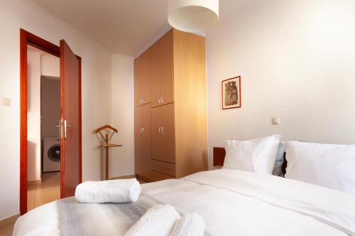 Ένα ή περισσότερα κρεβάτια σε δωμάτιο στο Spartan Gem Apartment