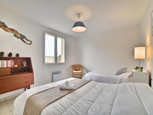 Katil atau katil-katil dalam bilik di Holiday Home beaurepaire by Interhome