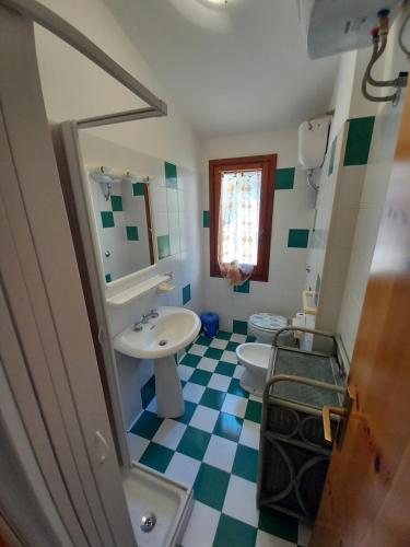 a bathroom with a sink and a toilet at Casa Maci in Torre Dei Corsari