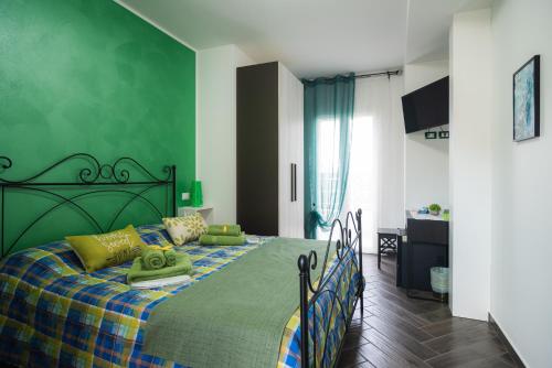 Posteľ alebo postele v izbe v ubytovaní la casa dei limoni