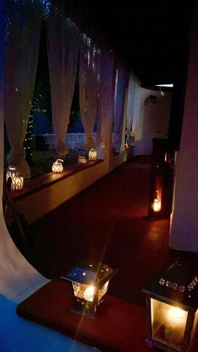 a room with a mirror and a table with lights at Sardinia Del Sud in Porto Columbu - Perdʼe Sali