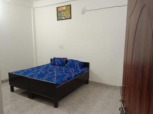 Postel nebo postele na pokoji v ubytování Ramrameti Homestay