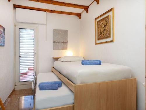 Ένα ή περισσότερα κρεβάτια σε δωμάτιο στο Holiday Home Cataluña by Interhome