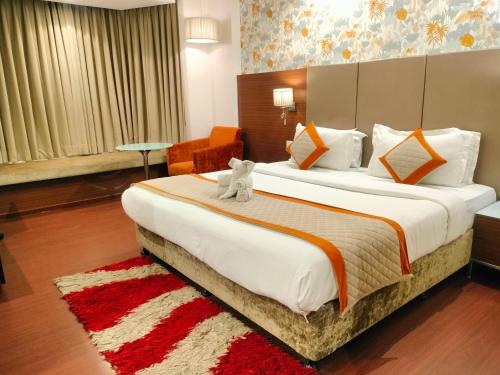 Ένα ή περισσότερα κρεβάτια σε δωμάτιο στο Hotel 5 Flowers Ananta Elite