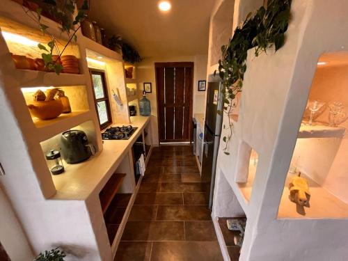 a hallway of a tiny house with a staircase at Casa Nutabe - Casa de Campo en Girardota cerca a Medellín in Girardota