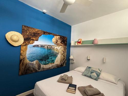 a room with a bed with a picture of a bridge at Loris Home playa ingles 50mt from Yumbo by luca properties gran canaria in San Bartolomé de Tirajana