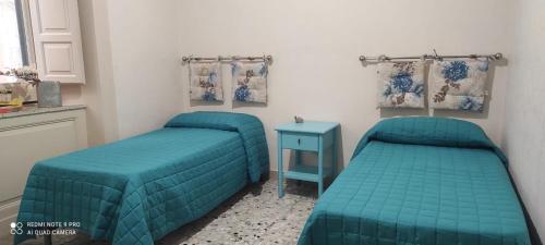Posteľ alebo postele v izbe v ubytovaní appartamento zona centralissima trapani